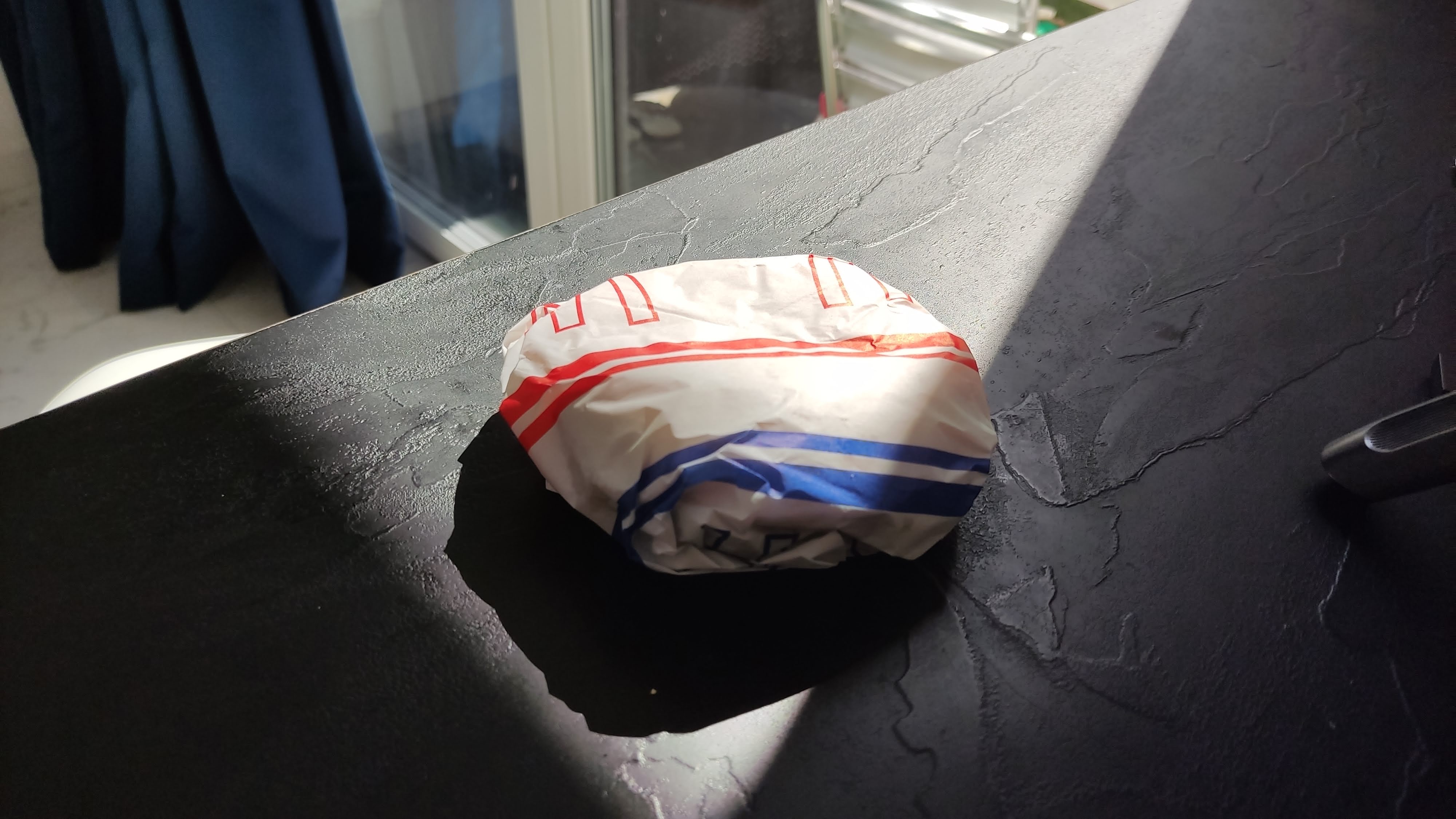 Jalapeño Burger: A Spicy Touch to Polish McDonald's Menu : Jalapeño burger in its signature paper wrap